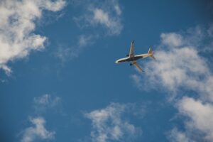 Worms Eye View of Airplane Flying on Sky