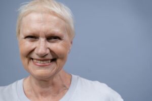 Smiling Woman in White Crew Neck Shirt